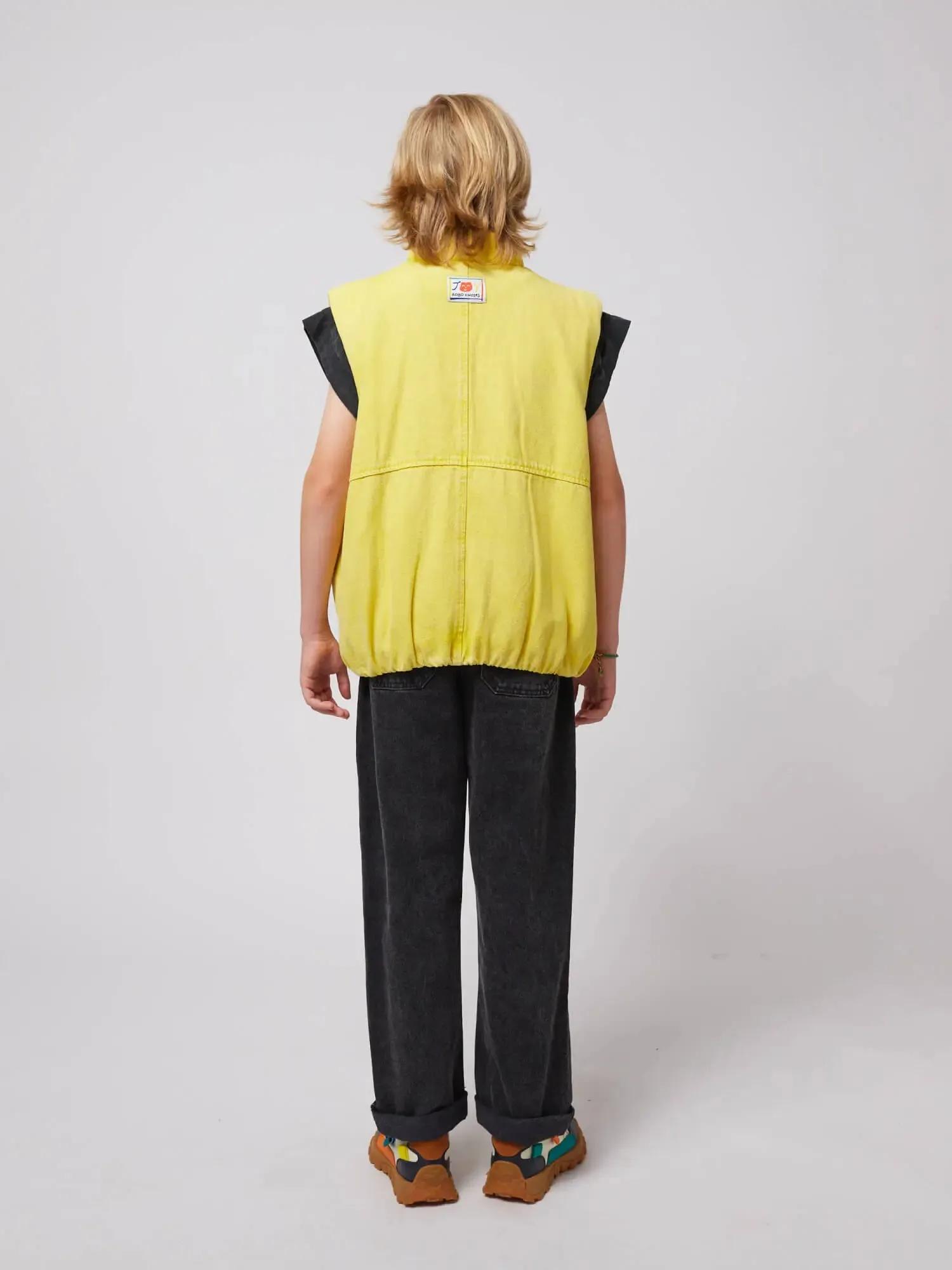 Smiling denim vest